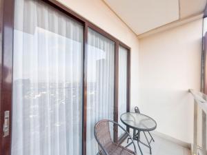 Elegant and Spacious 1BR at Patraland Amarta Apartment By Travelio