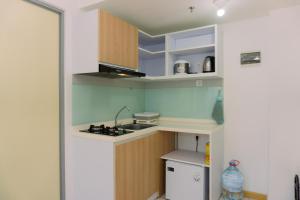Fancy and Simply 1BR Apartment at M-Town Residence By Travelio