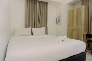 Fancy and Simply 1BR Apartment at M-Town Residence By Travelio