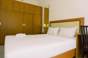 Warm and Minimalist 1BR Apartment at Scientia Residence By Travelio