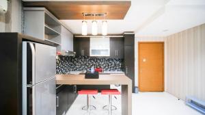 Homey and Cozy Living 2BR Apartment at Aryaduta Residence Surabaya By Travelio