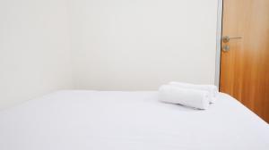 Homey 2BR at Puncak Permai Apartment By Travelio