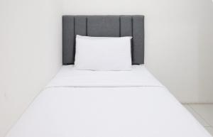 Homey 2BR at Puncak Permai Apartment By Travelio