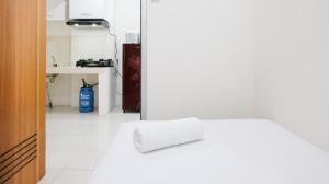 Homey 2BR at Puncak Permai Apartment By Travelio