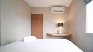 Minimalist and Beautiful 1BR with Extra Room at Pavilion Permata Apartment By Travelio