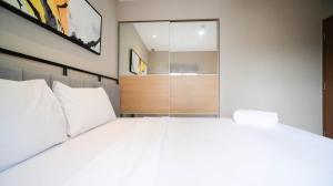 Minimalist and Beautiful 1BR with Extra Room at Pavilion Permata Apartment By Travelio