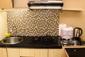 Comfy and Best Location Studio Room at Bassura City Apartment By Travelio