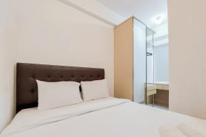 Fully Furnished 1BR with Study Room at Serpong Garden Apartment By Travelio