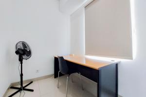 Fully Furnished 1BR with Study Room at Serpong Garden Apartment By Travelio