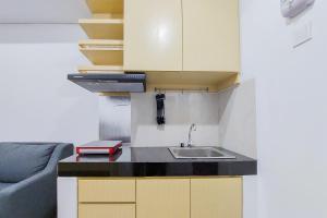 Fully Furnished 1BR with Study Room at Serpong Garden Apartment By Travelio