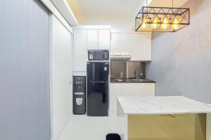 Comfortable and Minimalist 1BR at The Ayoma Apartment By Travelio