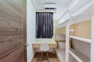 Comfortable Design 2BR with Washing Machine Sky House BSD Apartment By Travelio