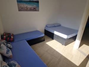 conforto a 2 minutos da praia do tombo com Wi-Fi e garagem