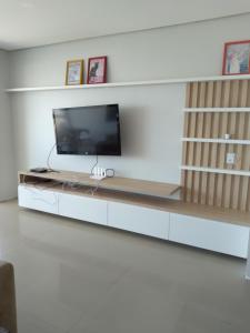 Amplo apartamento em Torres - 4 dormitórios