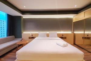 Scenic and Homey Studio Mataram City Apartment By Travelio