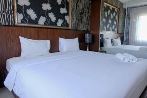 Spacious and Combine 3BR at The Edge Bandung Apartment By Travelio