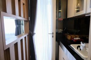 Spacious and Unique Studio with City View Apartment at Parahyangan Residence By Travelio