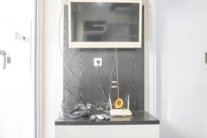 Cozy Stay 1BR at Green Pramuka City Apartment By Travelio