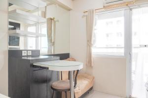Cozy Stay 1BR at Green Pramuka City Apartment By Travelio