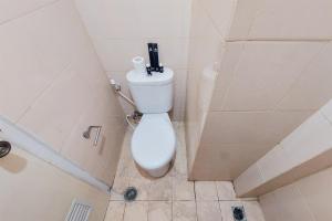 Cozy and Minimalist Studio at Serpong Greenview Apartment By Travelio