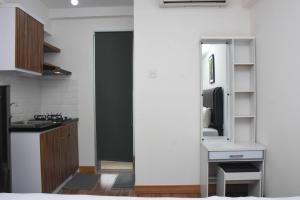 Elegant and Comfy Studio at Bassura City Apartment By Travelio