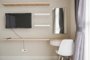 Minimalist and Comfort Living 1BR at Ciputra International Apartment By Travelio