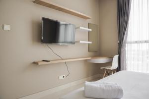 Minimalist and Comfort Living 1BR at Ciputra International Apartment By Travelio