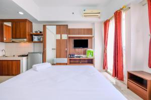 Warm and Cozy Studio at Margonda Residence 3 Apartment By Travelio