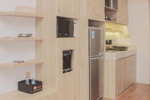 Minimalist and Cozy Studio at Vasanta Innopark Apartment By Travelio