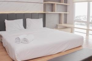 Minimalist and Cozy Studio at Vasanta Innopark Apartment By Travelio