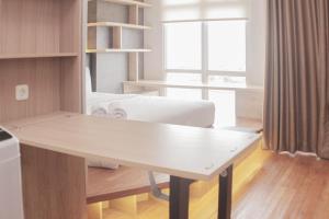 Minimalist and Cozy Studio at Vasanta Innopark Apartment By Travelio