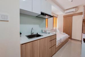 Comfort and Cozy Studio Apartment at B Residence By Travelio