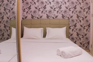 Warm and Homey 2BR at Springlake Summarecon Bekasi Apartment By Travelio