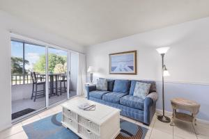 Relaxing inland condo with pool and steps to beach