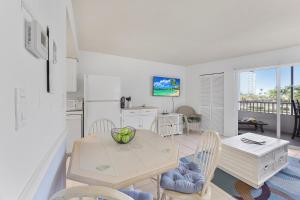 Relaxing inland condo with pool and steps to beach