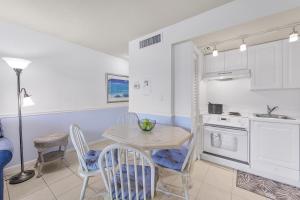 Relaxing inland condo with pool and steps to beach