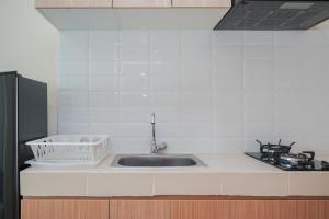 Studio Apartment with Cozy Design at B Residence By Travelio