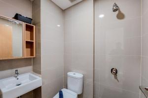 Studio Apartment with Cozy Design at B Residence By Travelio