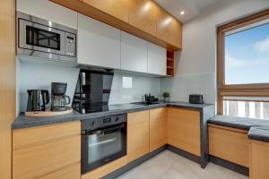 MilaBaltica Gym,Sauna & Parking by Lion Apartments