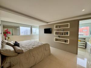 Apartamento 3 suĂtes em Torres frente MAR