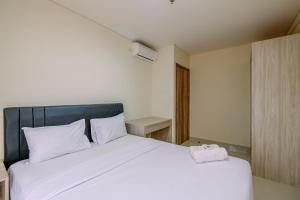 Comfort 1BR Apartment at Pejaten Park Residence By Travelio