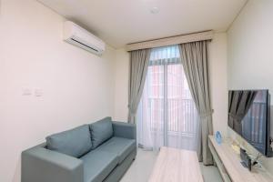 Comfort 1BR Apartment at Pejaten Park Residence By Travelio