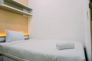 Homey and Comfort Stay 2BR Apartment Aeropolis Residence By Travelio