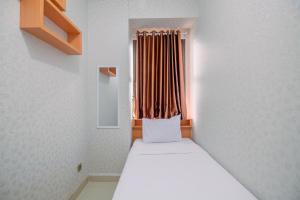 Stylish and Comfy 2BR at Transpark Cibubur Apartment By Travelio