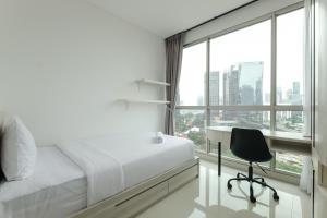 Cozy Living and Tidy 2BR Ciputra World 2 Apartment By Travelio