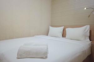 Minimalist and Combine 2BR at Green Pramuka City Apartment By Travelio