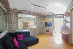 Minimalist and Combine 2BR at Green Pramuka City Apartment By Travelio