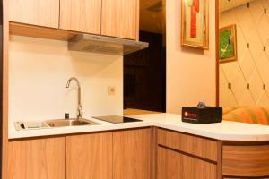 Nice and Enjoy 1BR at Sudirman Suites Apartment By Travelio