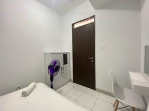 Bright and Relaxing 2BR Apartment at Mekarwangi Square Cibaduyut By Travelio