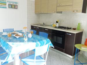 Two-Bedroom Apartment room in Il Mare di Alida